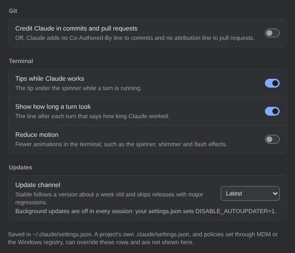 The last groups of Settings, Claude Code. Git: Credit Claude in commits and pull requests, off. Terminal: Tips while Claude works, on; Show how long a turn took, on; Reduce motion, off. Updates: Update channel, set to Latest, and under it: Background updates are off in every session: your settings.json sets DISABLE_AUTOUPDATER=1. At the foot: Saved in ~/.claude/settings.json. A project’s own .claude/settings.json, and policies set through MDM or the Windows registry, can override these rows and are not shown here.