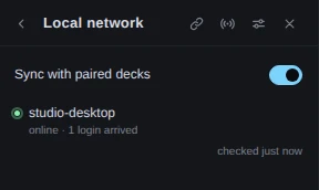 The Local network view with one paired deck, studio-desktop, marked green, and under it online · 1 login arrived. The header now has a broadcast button between the link and the sliders, and the foot of the list reads checked just now.